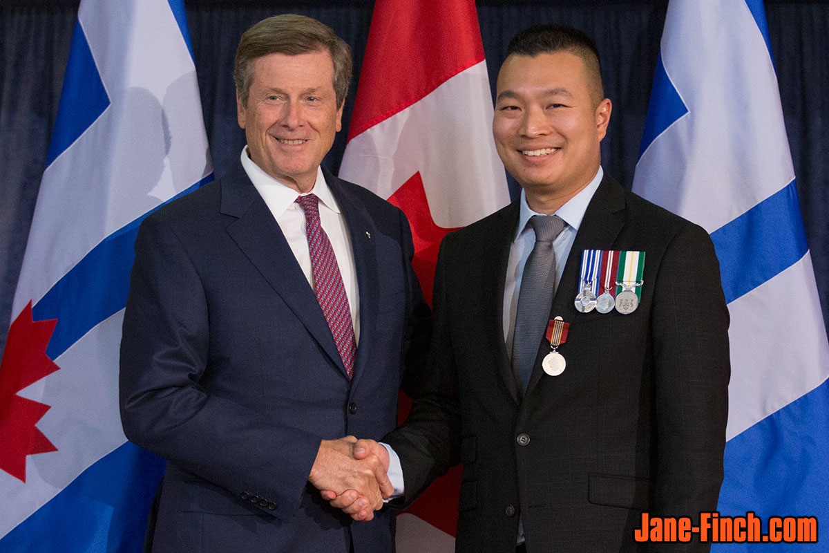 Paul Nguyen receives the Governor General's Sovereign's Medal for Volunteers from Toronto Mayor John Tory