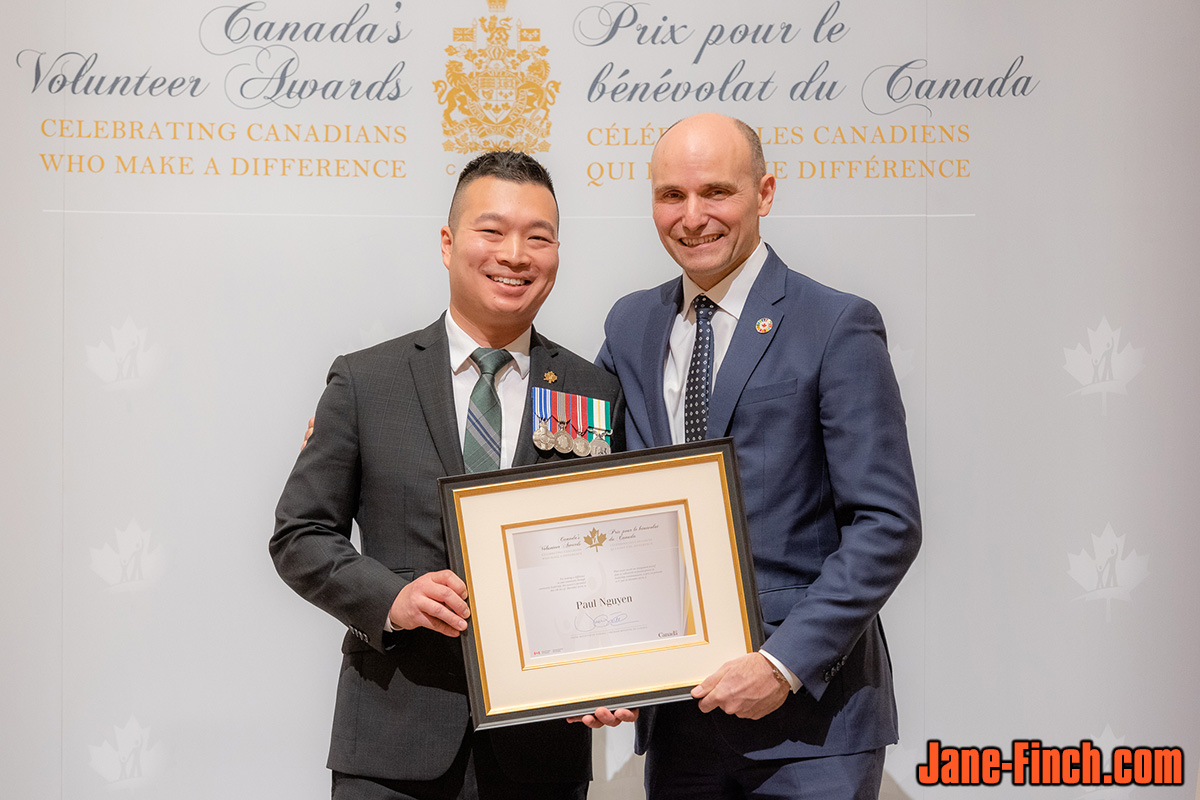 Paul Nguyen receives the June Callwood Award from Minister of Citizenship and Immigration, the honourable Laura Albanese